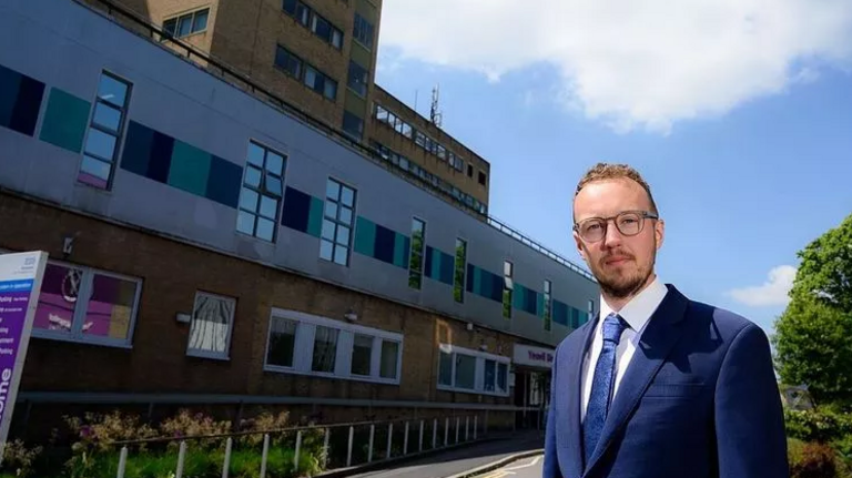 Adam outside hospital